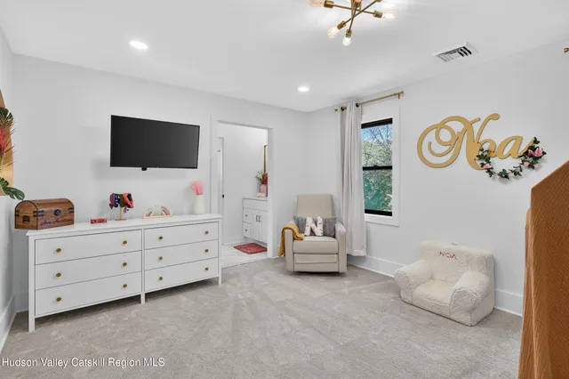 a bedroom with a bed and gym equipment