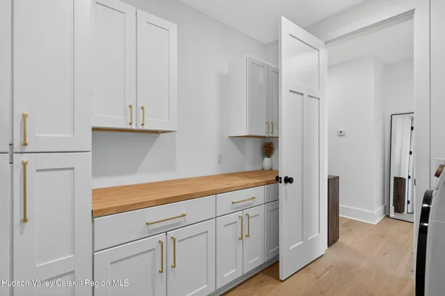 a room with gym equipment and a mirror