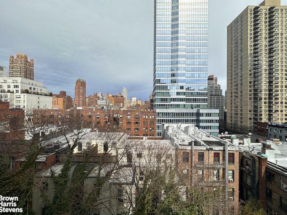 235 East 73rd Street, Unit 8D Manhattan, NY 10021 - Photo 6 of 10 a city view with tall buildings