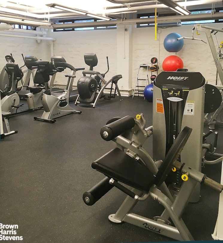 235 East 73rd Street, Unit 8D Manhattan, NY 10021 - Photo 7 of 10 a room with gym equipment