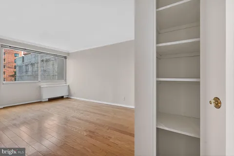a view of an empty room with a window