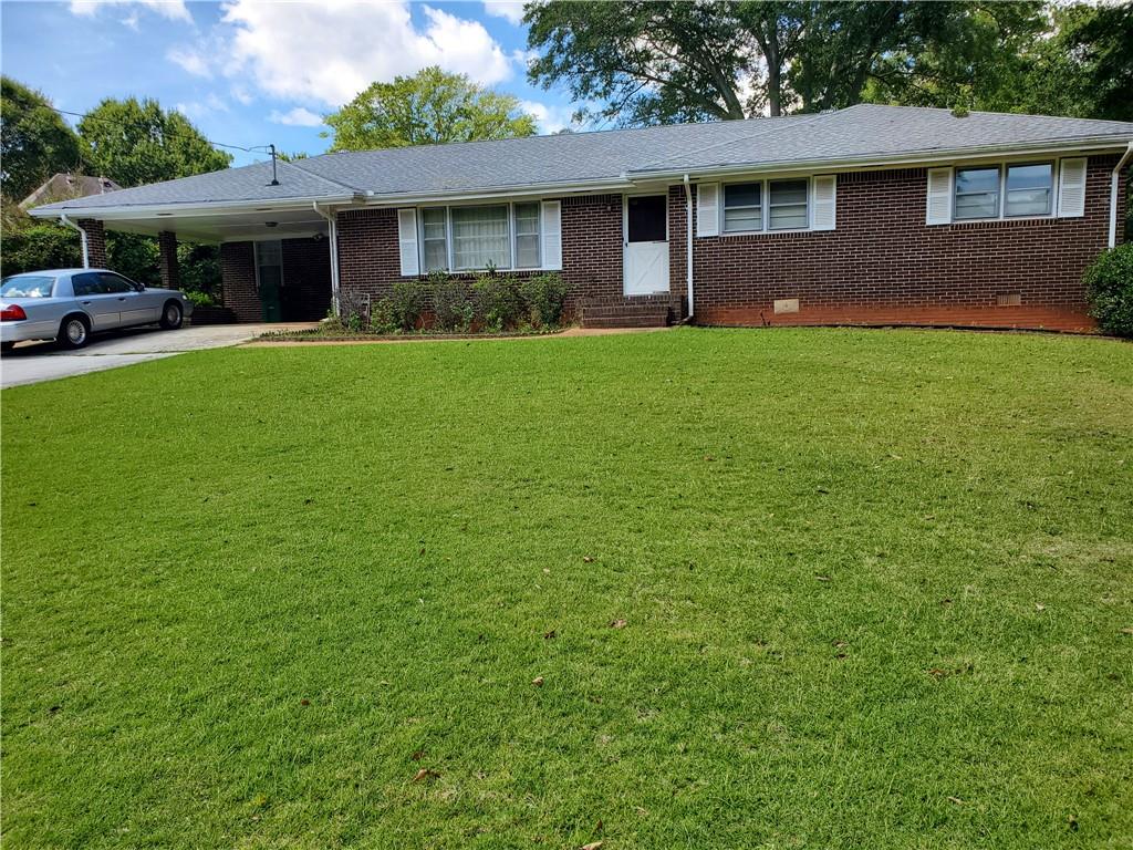 1666 Montreal Road Tucker, GA 30084 - Photo 1 of 1 Front view of Brick Ranch Home on Basement