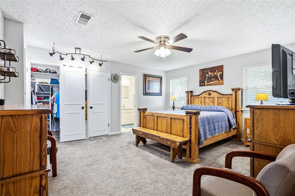 235 Magnus Road Denison, TX 75021 - Photo 17 of 35 a bedroom with bed and window