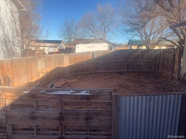 a view of a backyard of the house