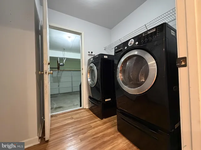 a white toilet sitting next to a small sink