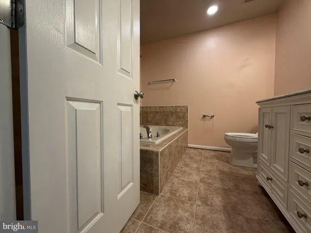 an empty room with closet area