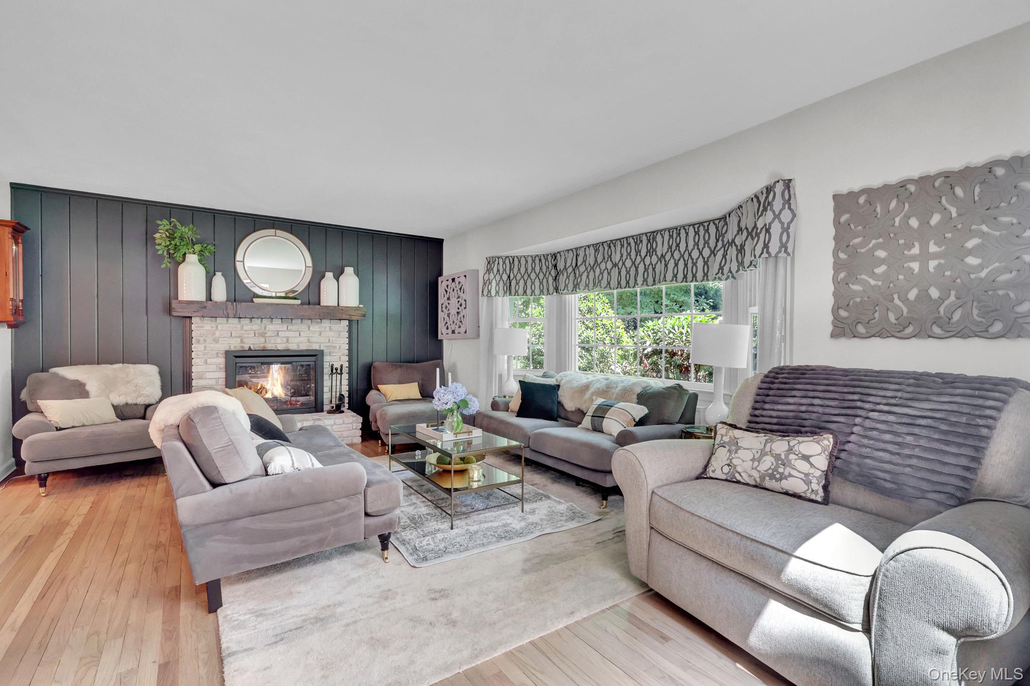 121 Old Field Road Huntington, NY 11743 - Photo 7 of 38 Living room with fireplace opened to dining room.
