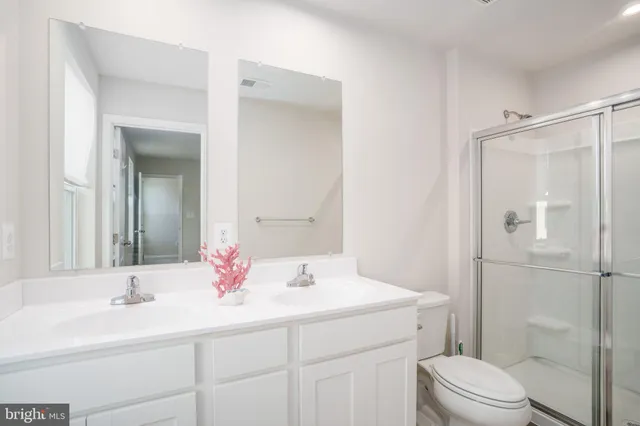 a bedroom with a bed and a tv