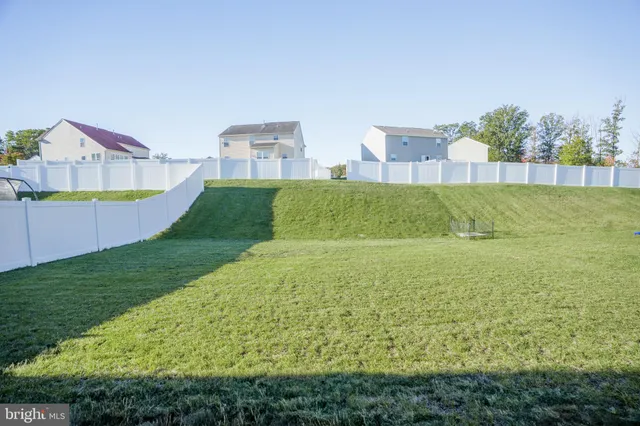 a view of a swimming pool with a yard