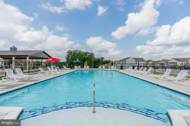 a view of swimming pool from a balcony