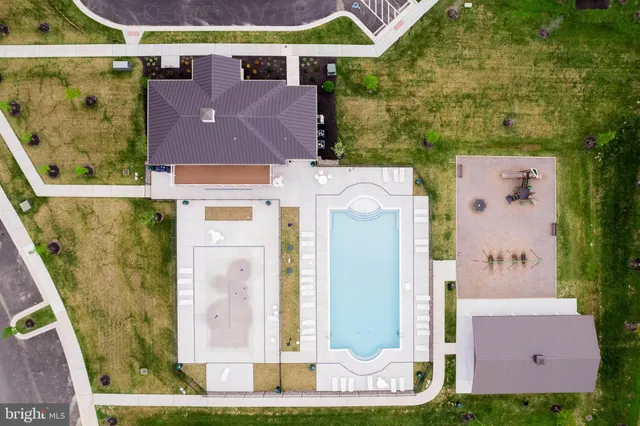 an aerial view of residential house with outdoor space and parking