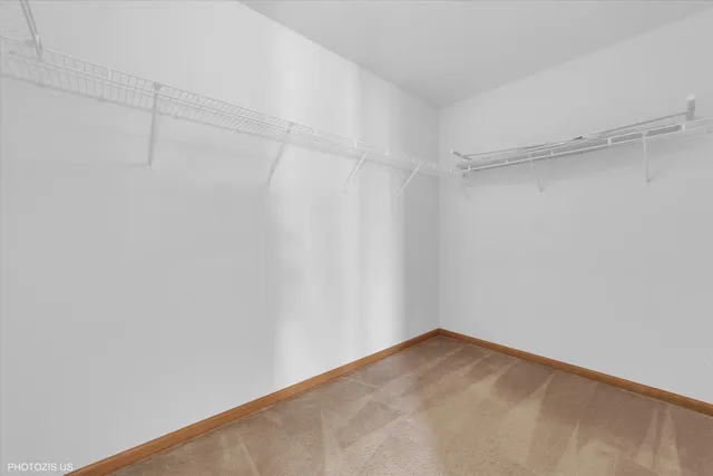 a view of a hallway with closet area