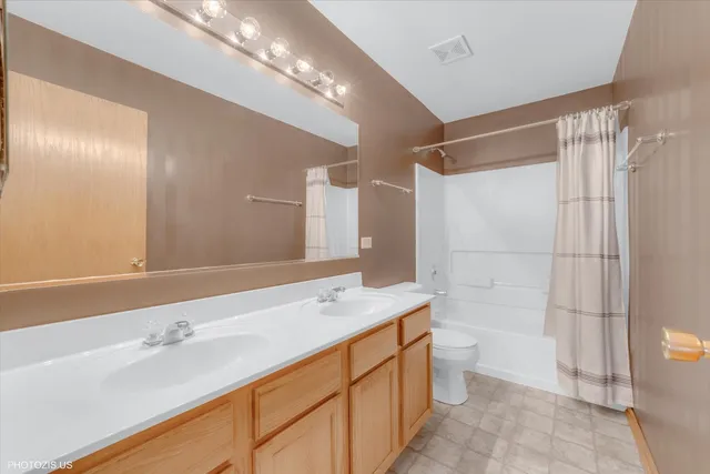 a view of a big room with windows and cabinet