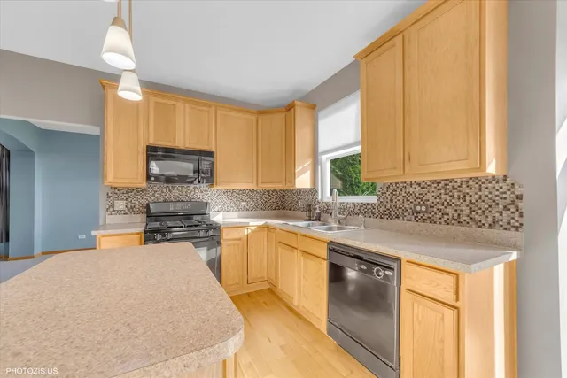 a spacious bedroom with a bed and a cabinets