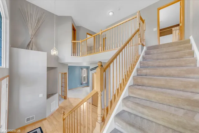 a view of an entryway with wooden floor