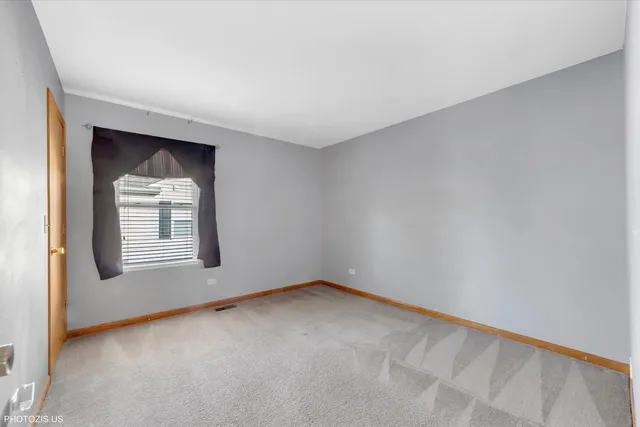 a view of a big room with windows