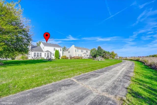 an aerial view of a house with a garden