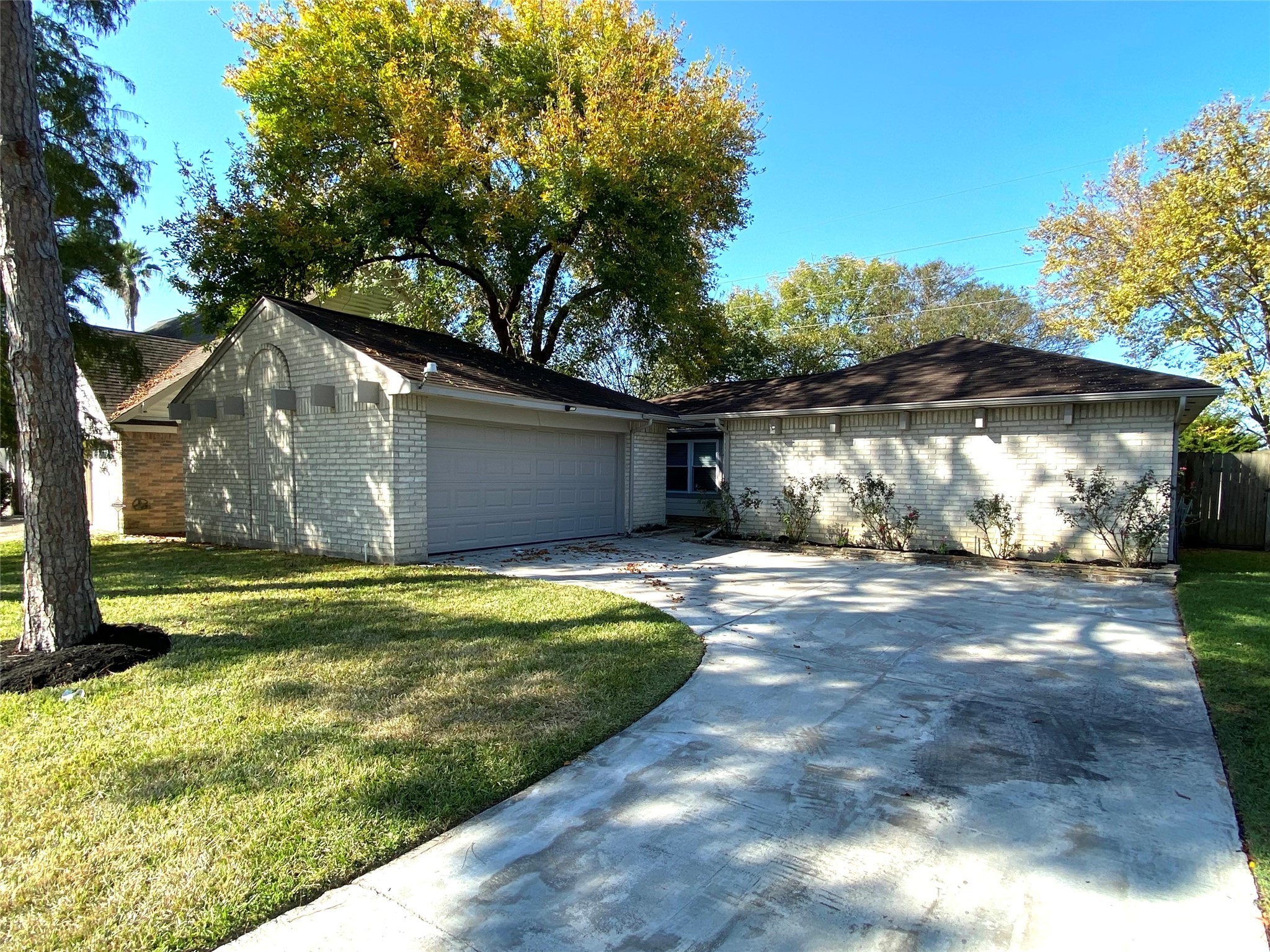 4806 Temple Bell Drive Spring, TX 77388 - Photo 1 of 15 a front view of a house with a yard and garage
