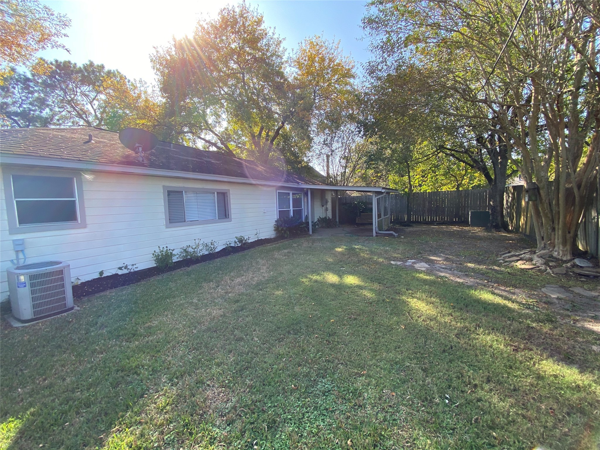 4806 Temple Bell Drive Spring, TX 77388 - Photo 15 of 15 a view of a backyard with a small cabin and a chair