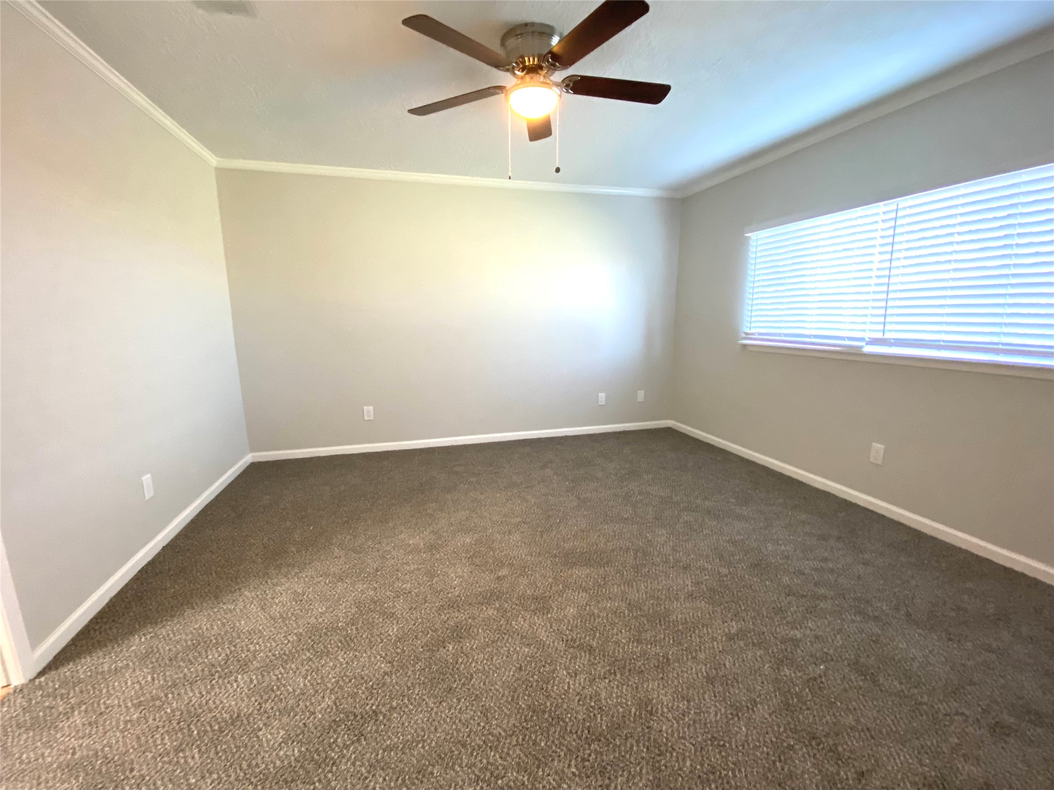 4806 Temple Bell Drive Spring, TX 77388 - Photo 7 of 15 an empty room with a window and a ceiling fan