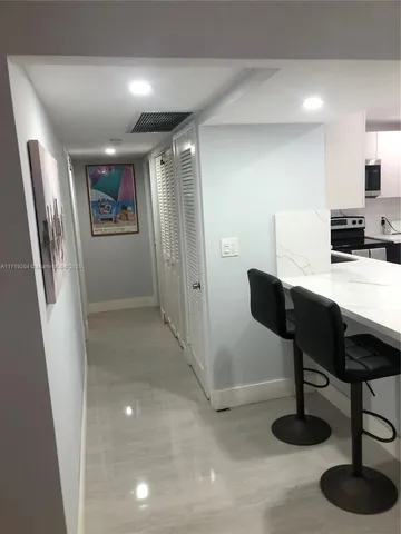 a view of a livingroom with furniture and a ceiling fan