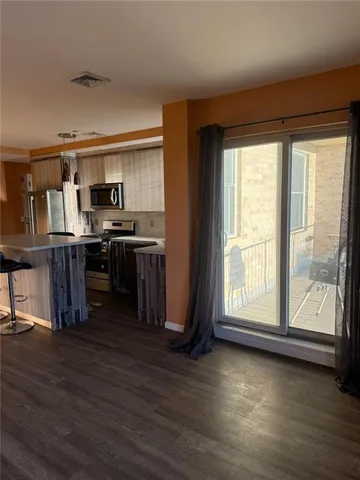 a view of workspace with wooden floor and furniture