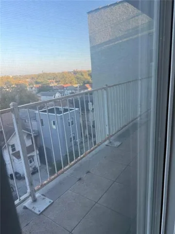 a view of a balcony with an outdoor space