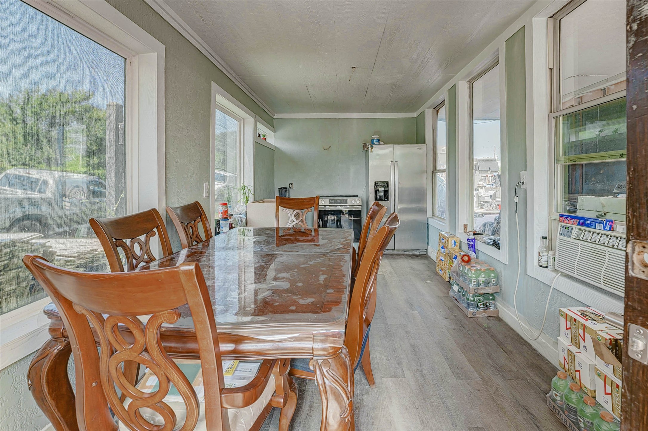 3623 Inez Street Fresno, TX 77545 - Photo 25 of 33 a view of a dining room with furniture a chandelier and wooden floor