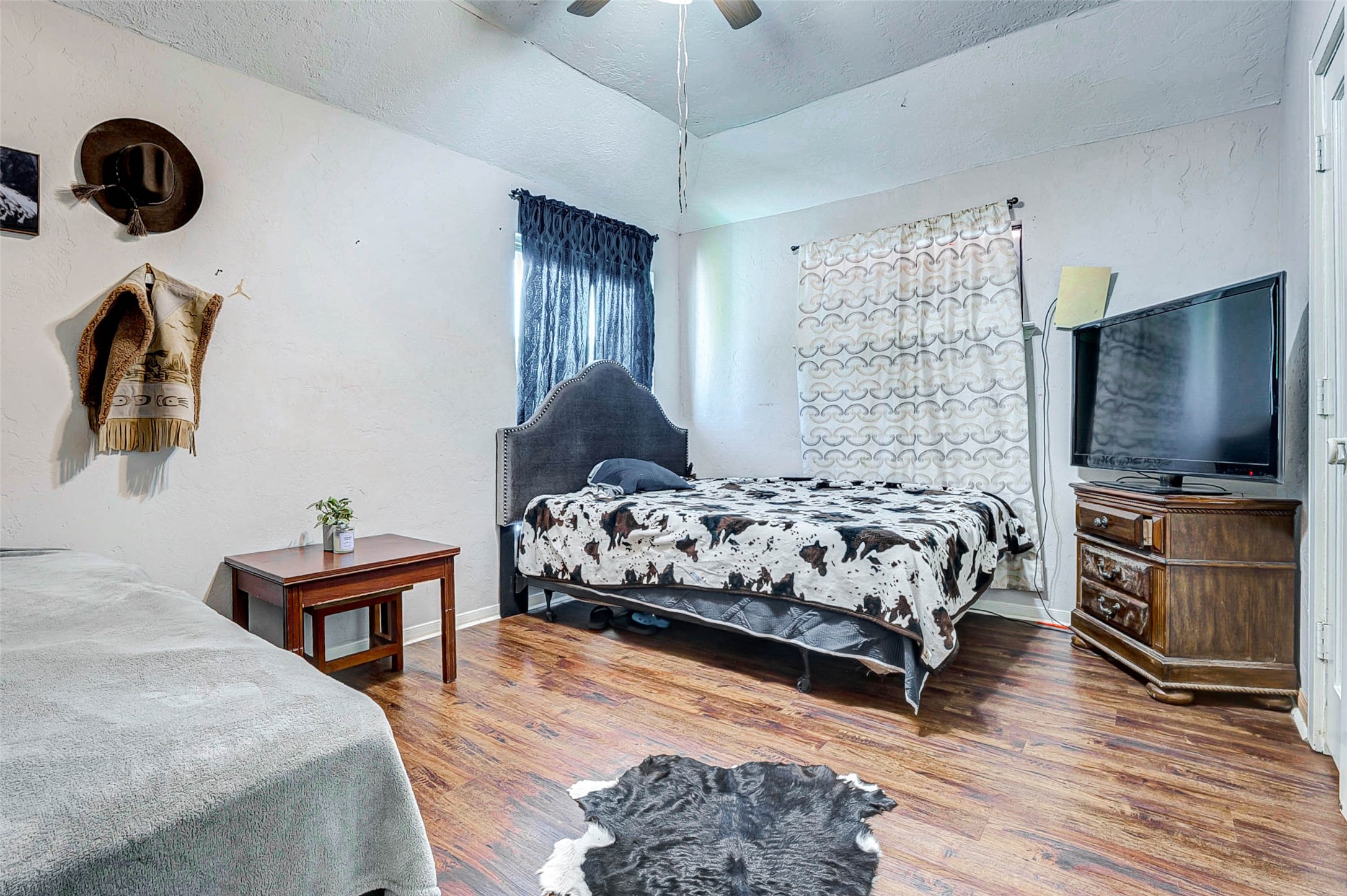 3623 Inez Street Fresno, TX 77545 - Photo 27 of 33 a bedroom with a bed and flat screen tv