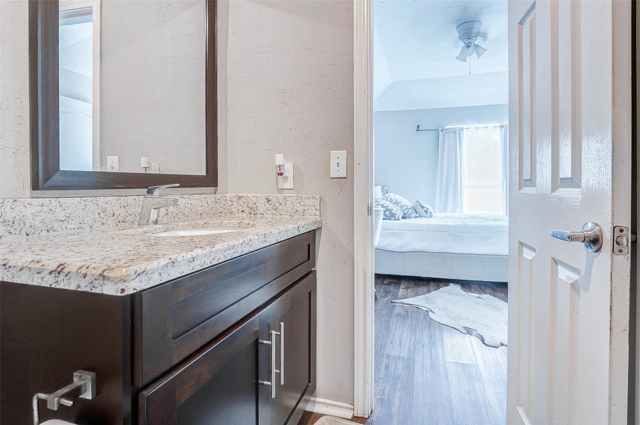 3623 Inez Street Fresno, TX 77545 - Photo 4 of 33 a en suite bathroom with a granite countertop sink and a mirror