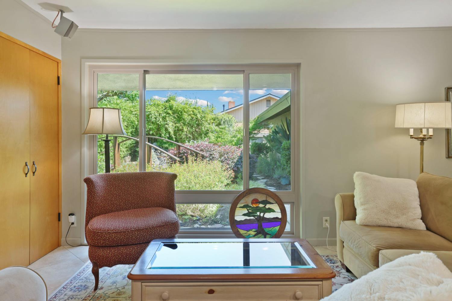 2406 Kenmore Court Modesto, CA 95350 - Photo 24 of 54 a living room with furniture and a window