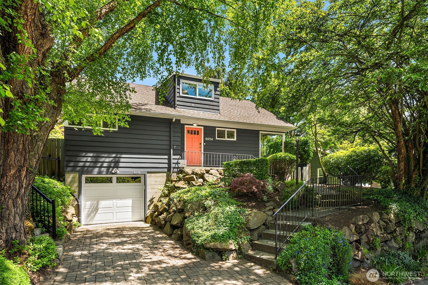 6034 40th Avenue Northeast Seattle, WA 98115 - Photo 1 of 40 a front view of a house with garden
