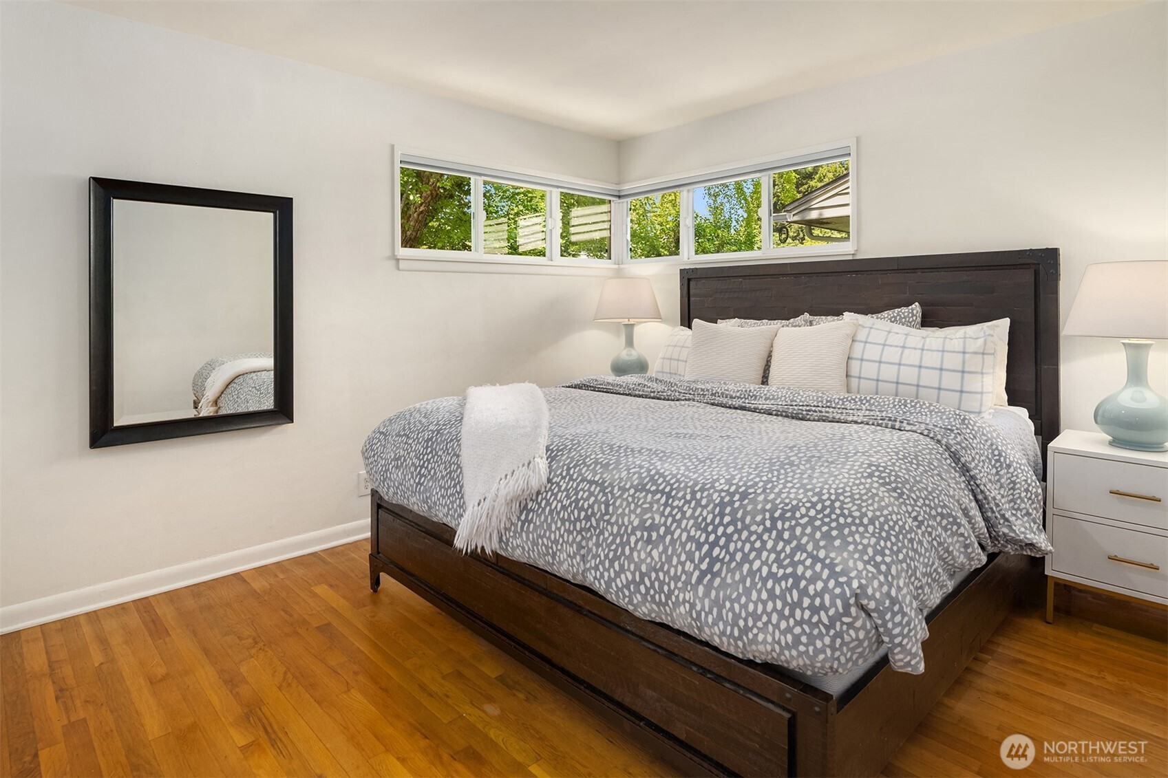 6034 40th Avenue Northeast Seattle, WA 98115 - Photo 15 of 40 a bed sitting in a bedroom next to a window