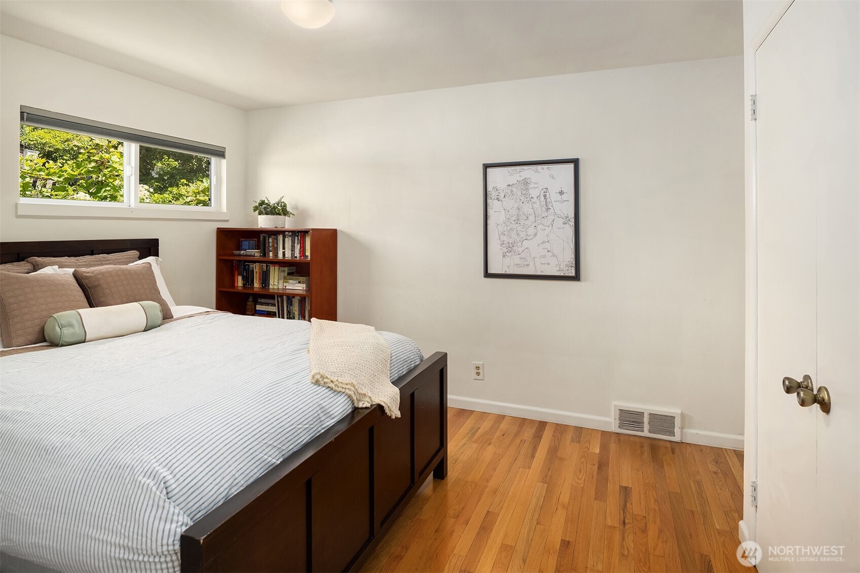 6034 40th Avenue Northeast Seattle, WA 98115 - Photo 16 of 40 a bed sitting in a bedroom next to a window