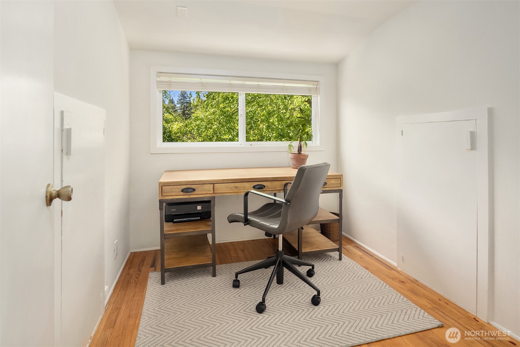6034 40th Avenue Northeast Seattle, WA 98115 - Photo 20 of 40 a view of a workspace with furniture and a window