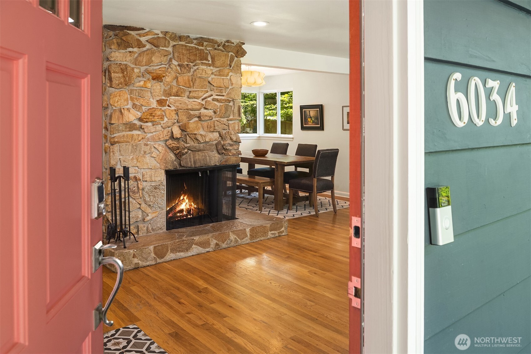 6034 40th Avenue Northeast Seattle, WA 98115 - Photo 2 of 40 a view of a livingroom with fireplace and dining area