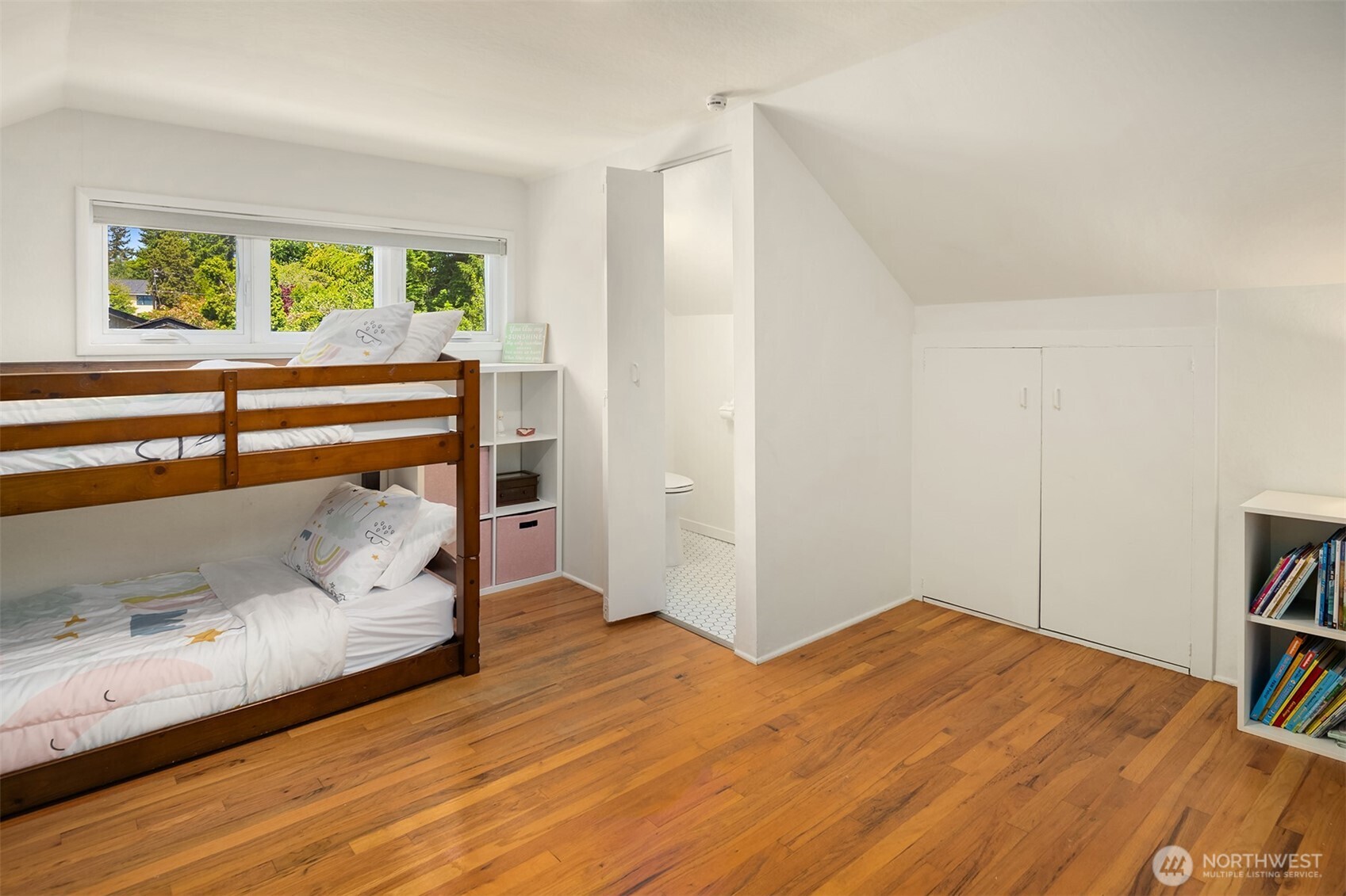 6034 40th Avenue Northeast Seattle, WA 98115 - Photo 21 of 40 a bedroom with a bed and a window with wooden floor