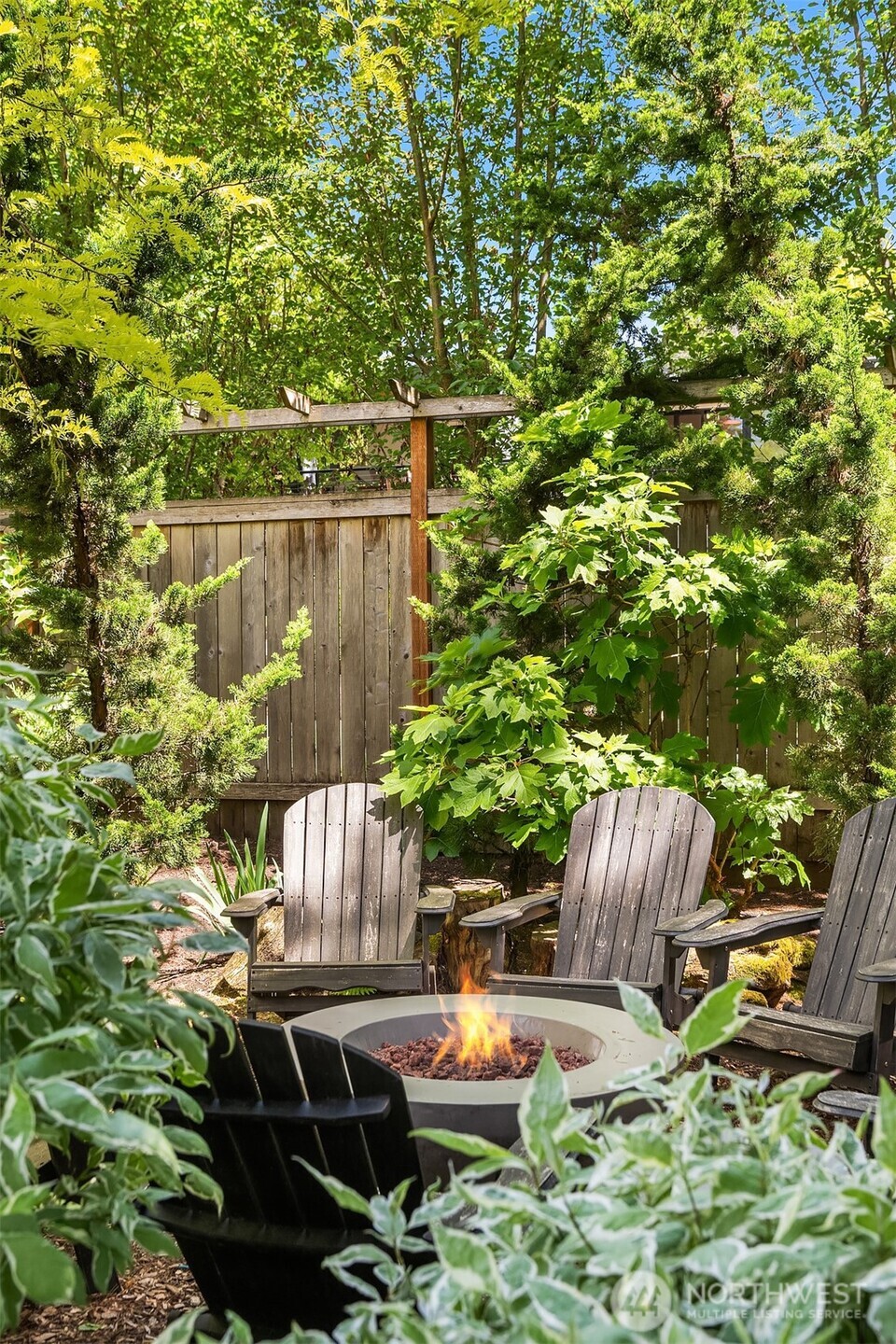 6034 40th Avenue Northeast Seattle, WA 98115 - Photo 26 of 40 a backyard of a house with table and chairs