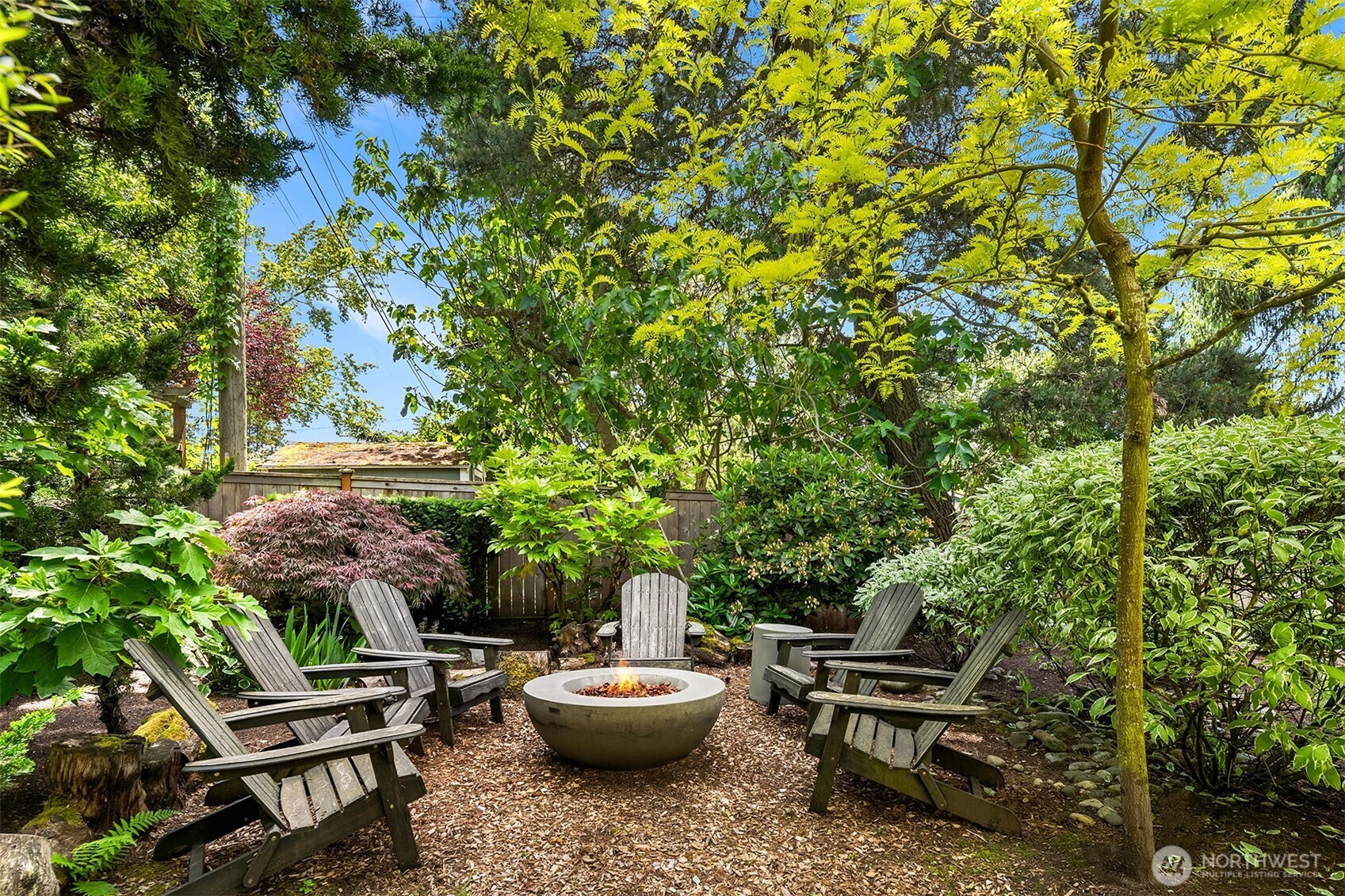 6034 40th Avenue Northeast Seattle, WA 98115 - Photo 27 of 40 a backyard of a house with fire pit and outdoor seating