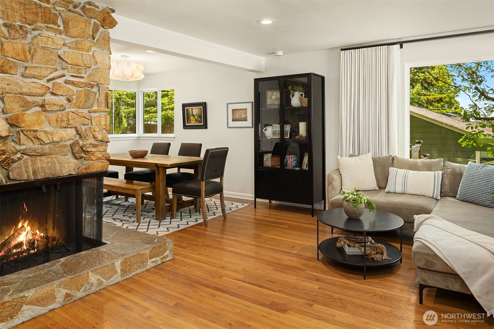 6034 40th Avenue Northeast Seattle, WA 98115 - Photo 4 of 40 a living room with furniture and a fireplace