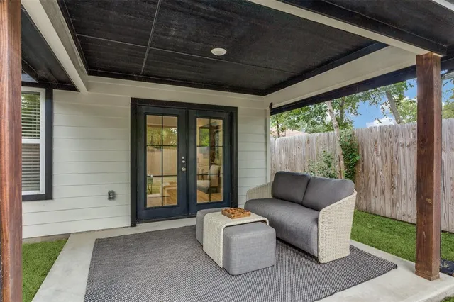 a balcony with furniture and a garden