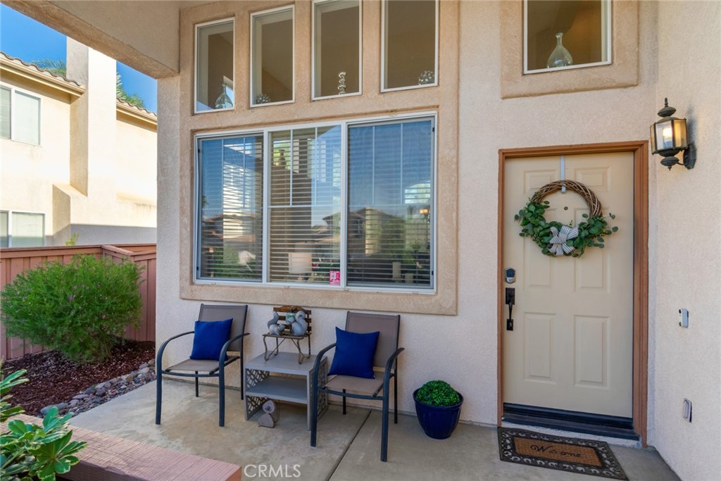 20885 Bakal Drive Riverside, CA 92508 - Photo 5 of 47 a view of a two chairs in the back yard of the house