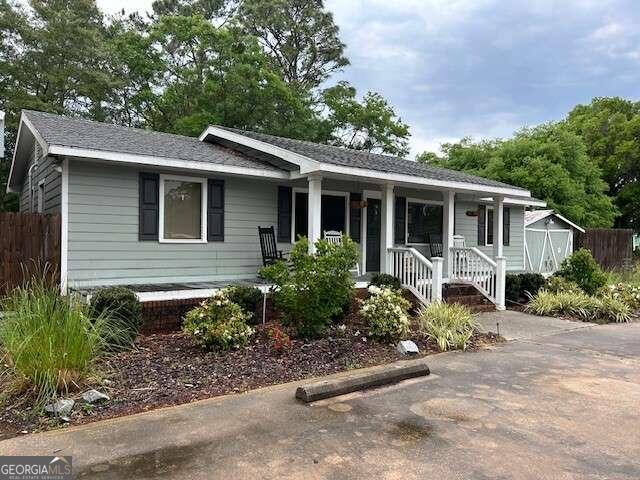 1819 Point Peter Road St. Marys, GA 31558 - Photo 1 of 4 a front view of a house with garden
