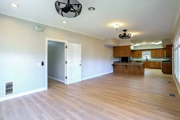 a view of kitchen with cabinets and wooden floor