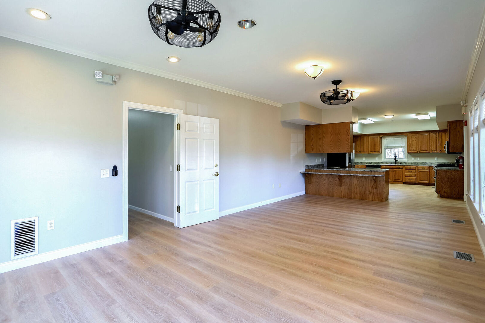 504 East Church Street Champaign, IL 61820 - Photo 11 of 55 a view of kitchen with cabinets and wooden floor