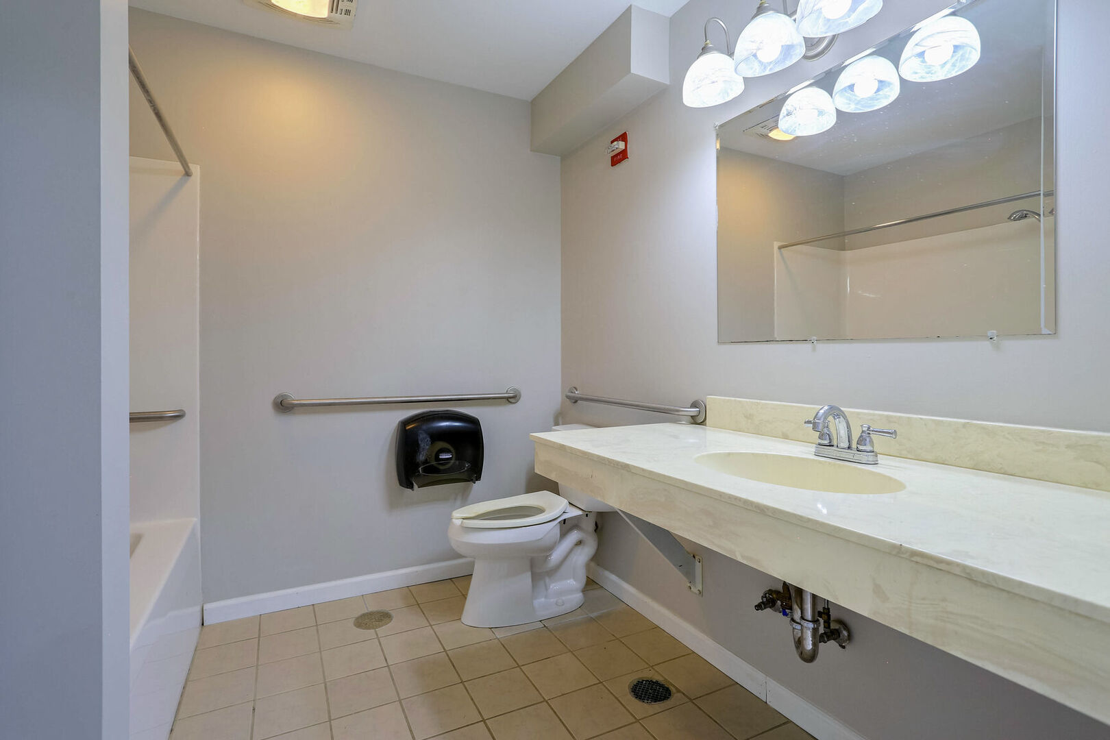 504 East Church Street Champaign, IL 61820 - Photo 38 of 55 a bathroom with a sink a toilet and a mirror