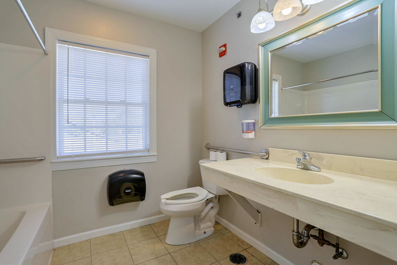 504 East Church Street Champaign, IL 61820 - Photo 39 of 55 a bathroom with a sink a toilet and mirror