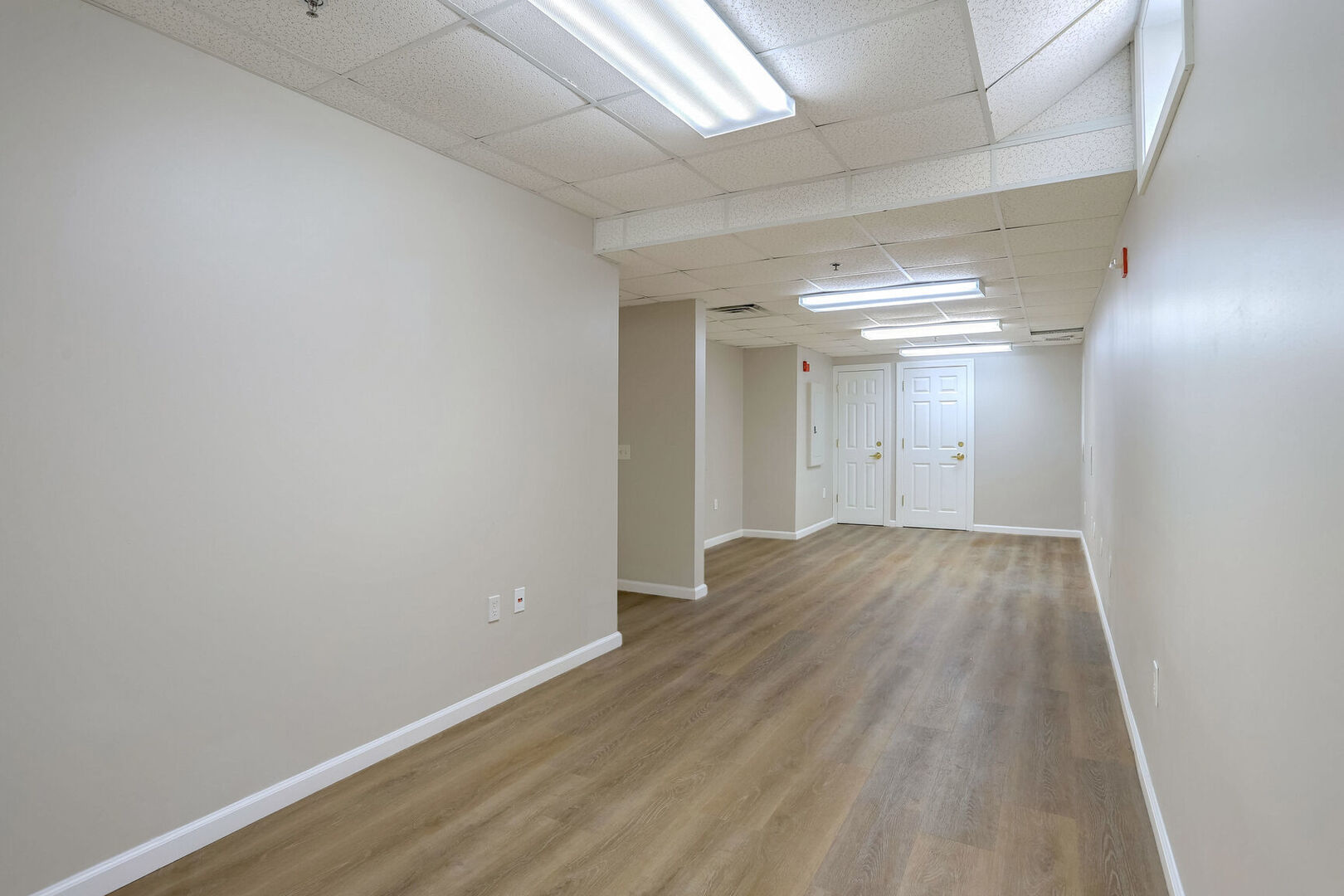 504 East Church Street Champaign, IL 61820 - Photo 41 of 55 wooden floor in a hall with an empty room
