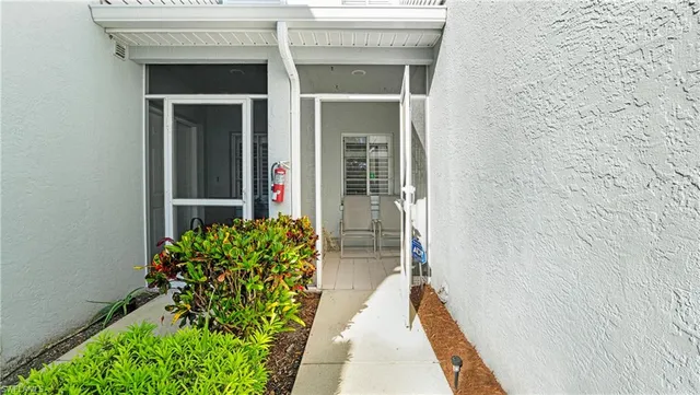 a entryway with flower pots