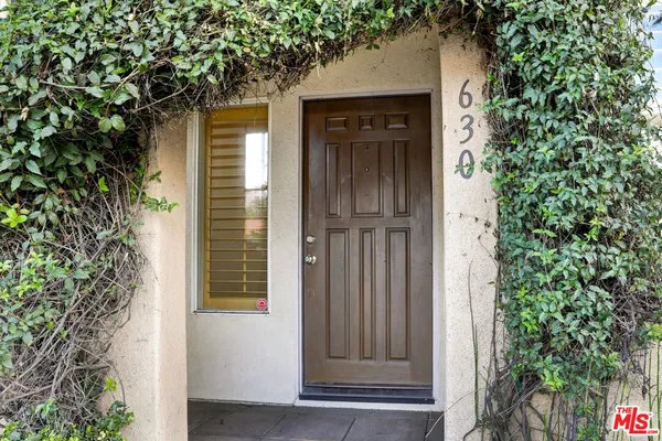 a view of a building with a yard